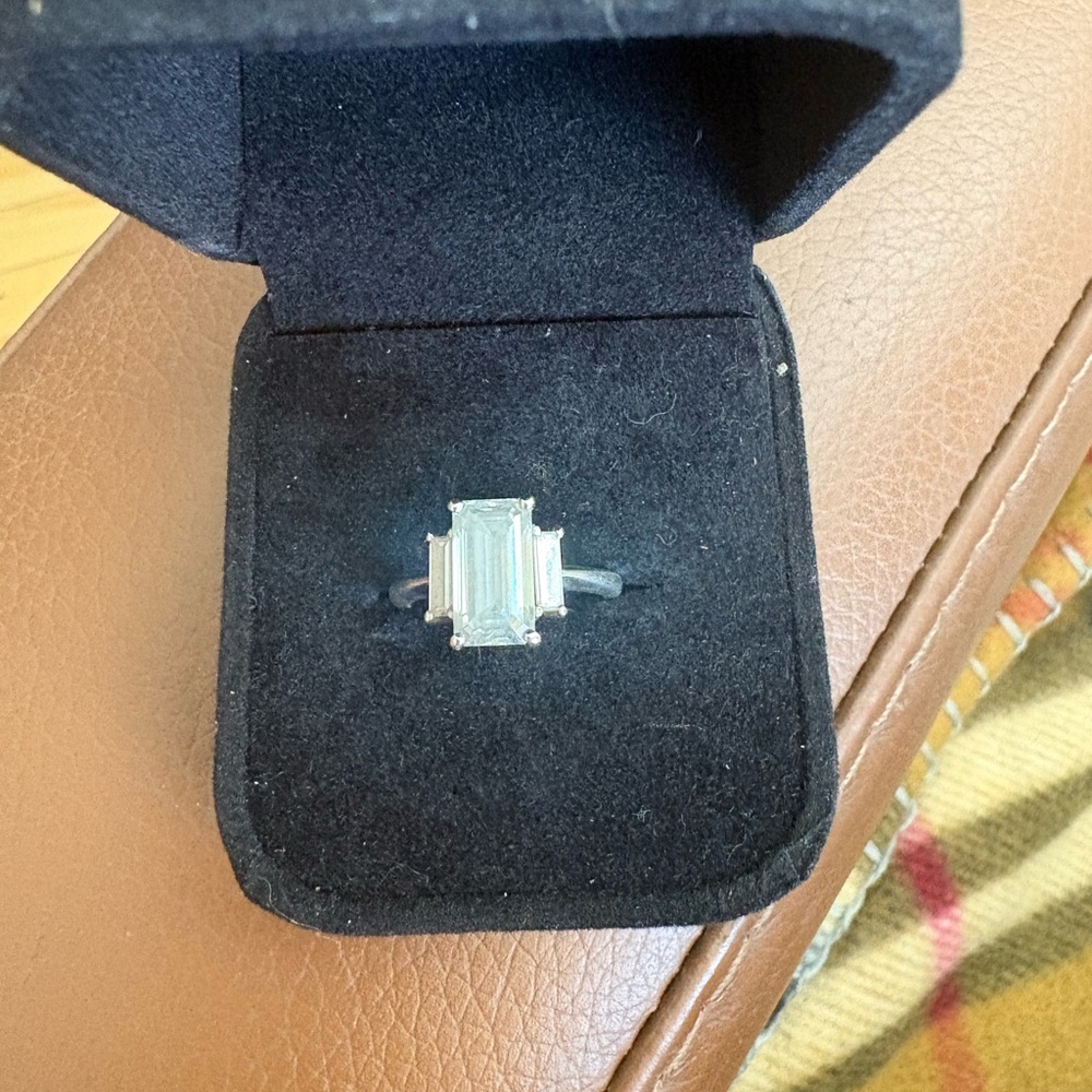 Emerald Cut Three Stone Colourless Moissanite Ring - Sterling Silver